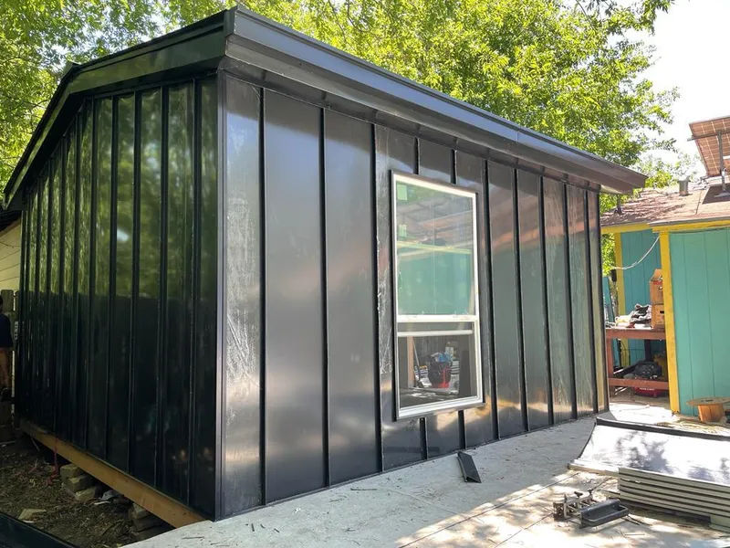 Black standing seam metal wall panels for Roof Inspection in Coweta